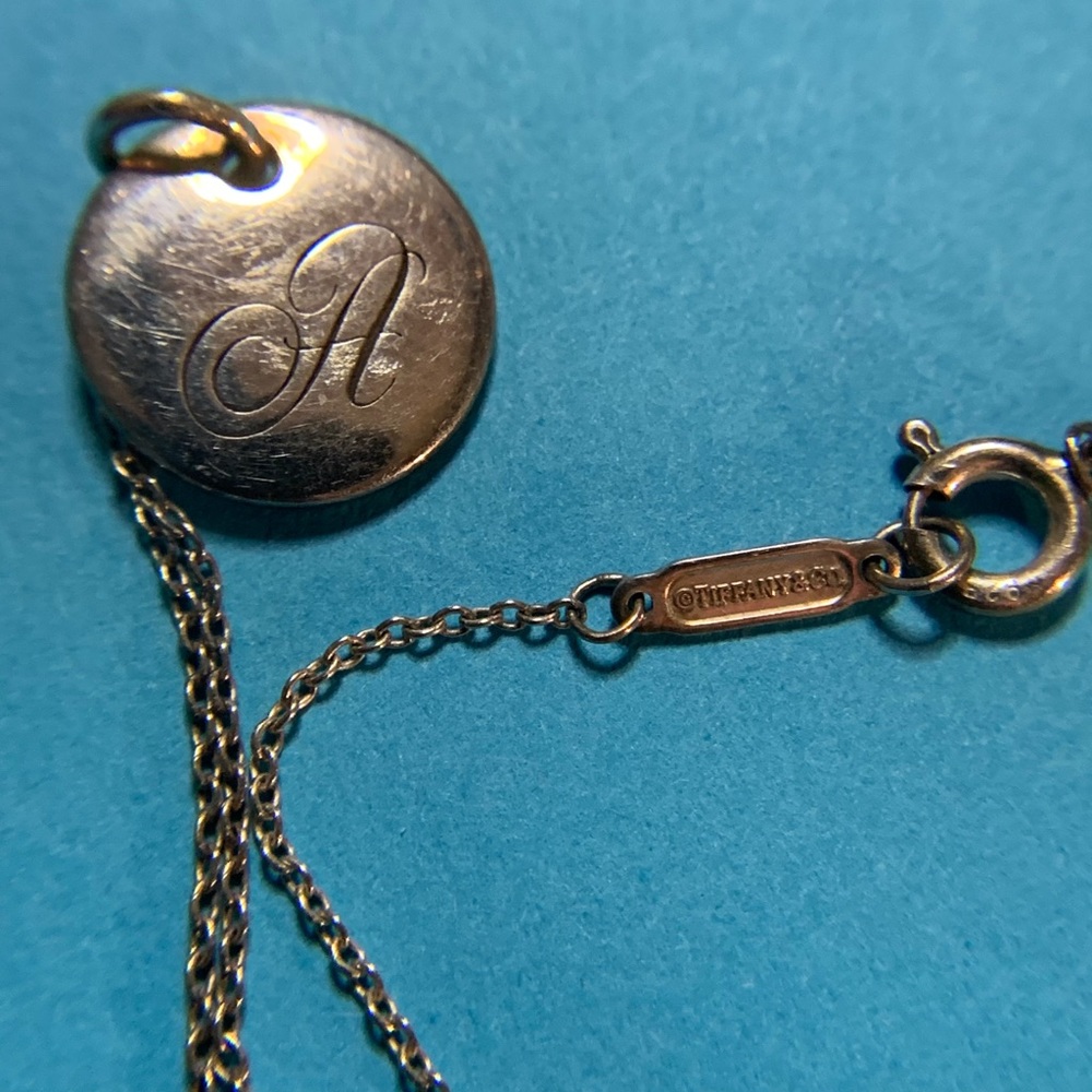 Tiffany’s initial necklace script A
